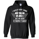 I really don't mind getting older but my body is taking it badly T-shirts CustomCat