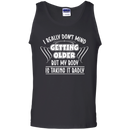 I really don't mind getting older but my body is taking it badly T-shirts CustomCat