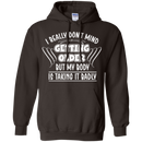 I really don't mind getting older but my body is taking it badly T-shirts CustomCat
