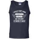 I really don't mind getting older but my body is taking it badly T-shirts CustomCat